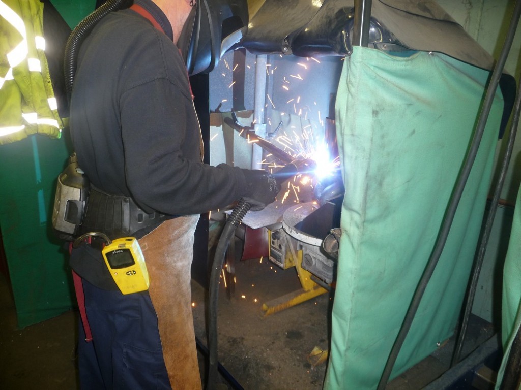Close up on welding bay and welding fumes