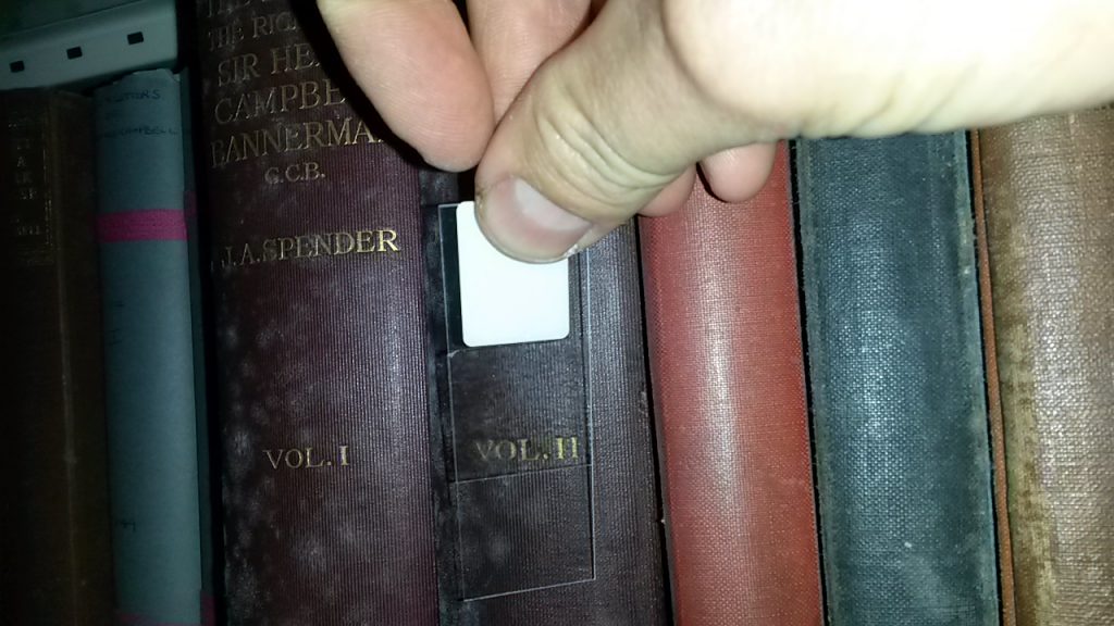 mould growing on books in library 
